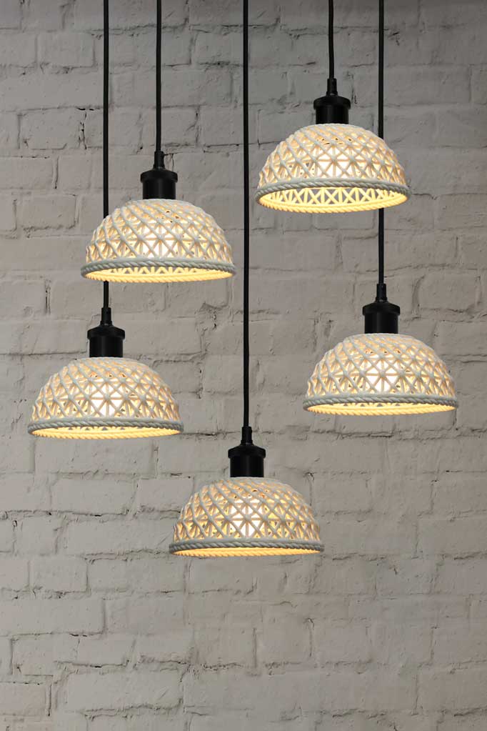 black  5-drop light chandelier featuring large ceramic shades