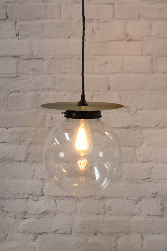 Medium glass ball pendant light with brass disc