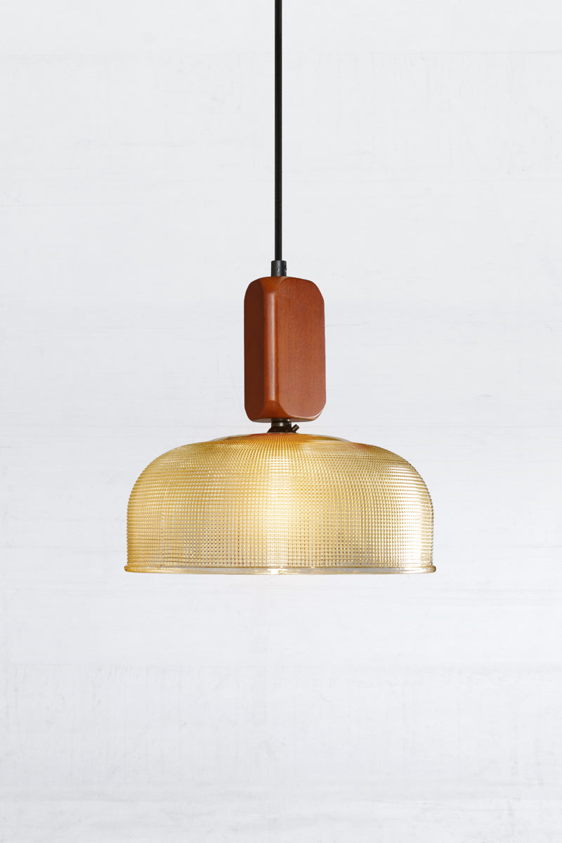 Large amber chapman shade with a woodblock pendant cord. 