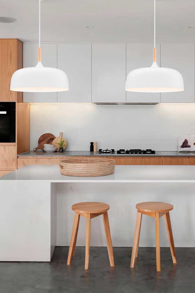 2 white pendant lights over kitchen island