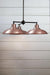 Bullpit Chandelier with three aged solid copper shades on a black, steel, three arm fixture.