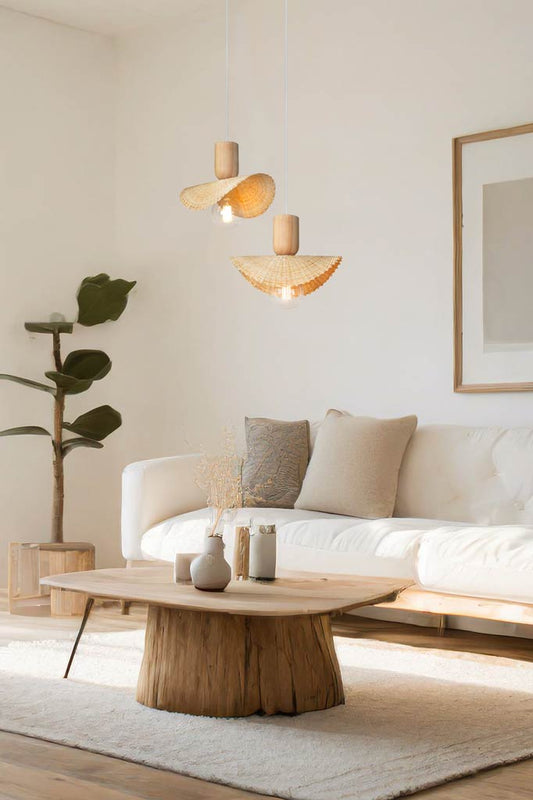 Two Bamboo woven pendants with timber block accents hanging in a bright lounge room. 