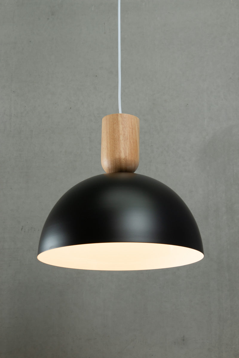 wooden blocks hanging with large steel black dome shade