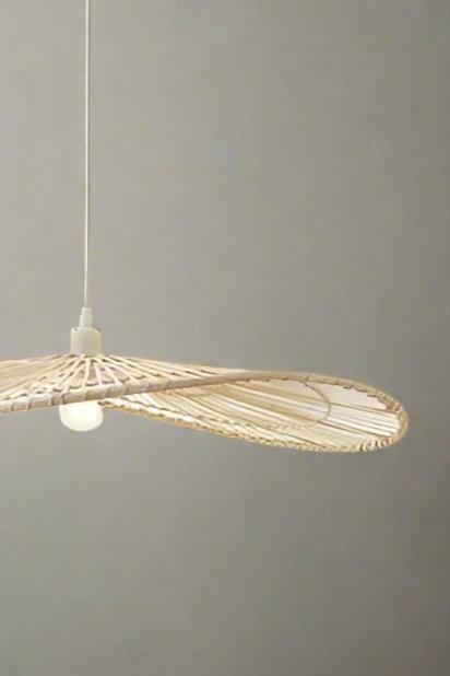 Circular bamboo light shade on a pendant cord