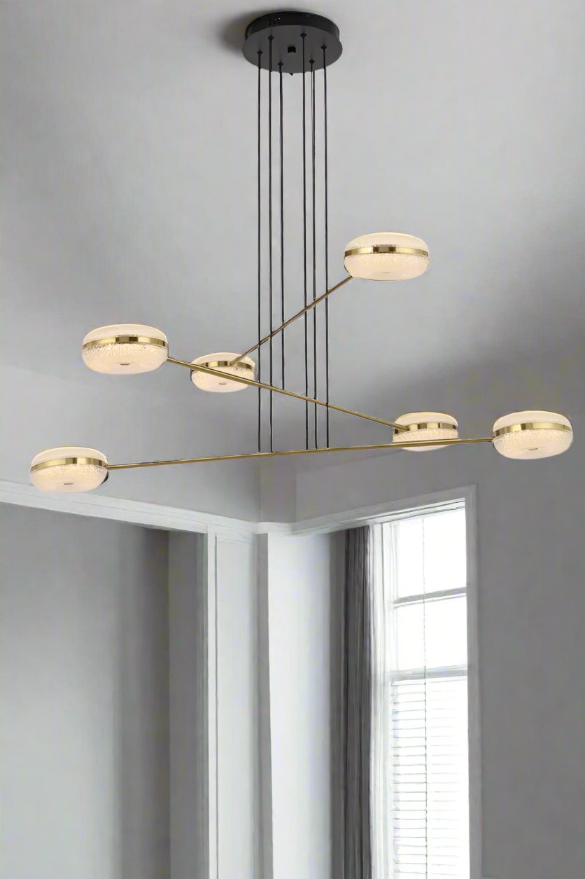 6 light chandelier including ceiling rose near a window