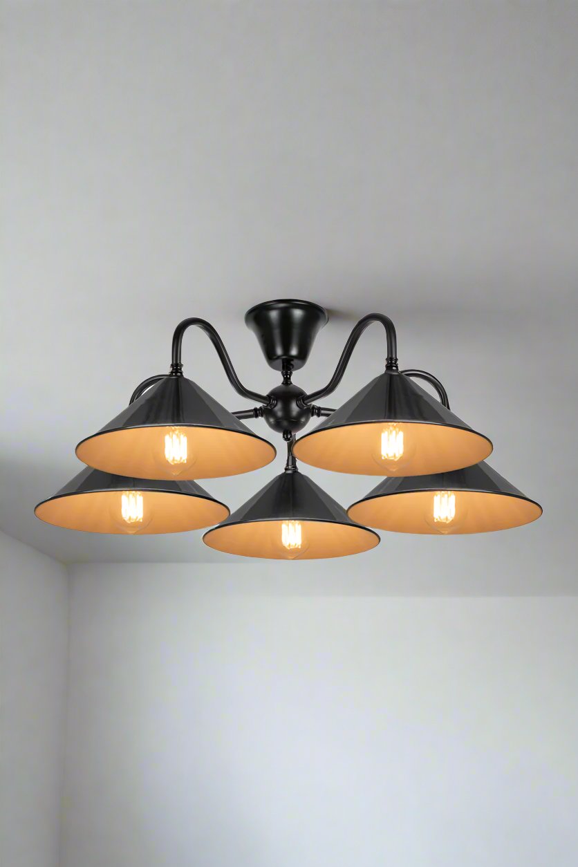 Five black cone shades on a five arm gooseneck flush mount. 