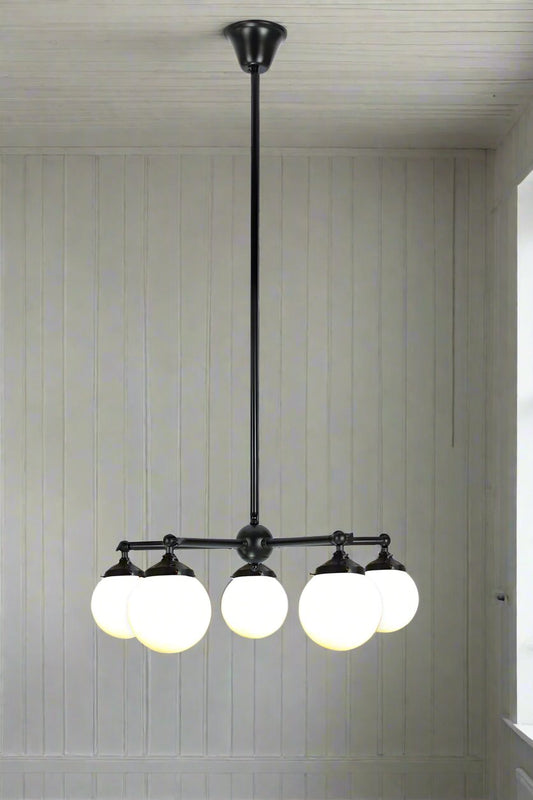 Black 5 straight arm chandelier with small opal shades. 