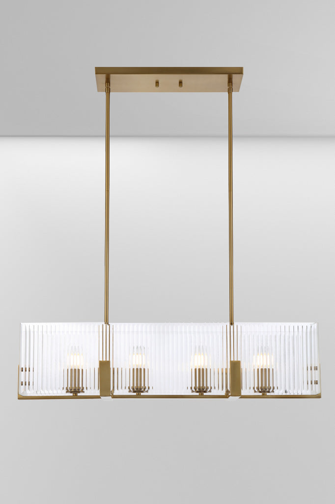 Front look at the four light Antique Gold pendant rectangular light with reeded glass panels. 