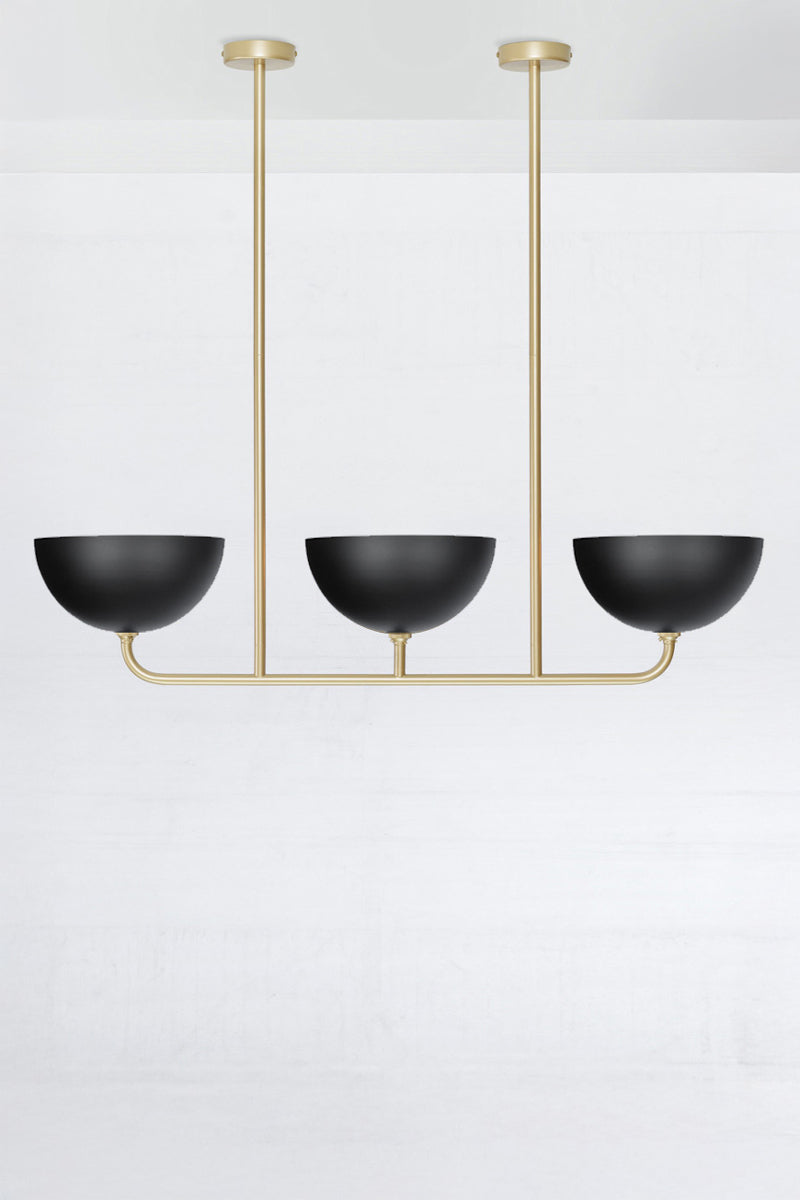 3 lamp Linear Chandelier in gold/brass, with black Dome shades.