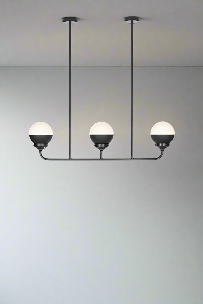 Crown sphear shades on a triple lamp linear black chandelier. 