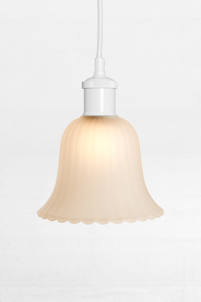 Lille Glass Pendant Light with white cord brings understated finesse to any interior.