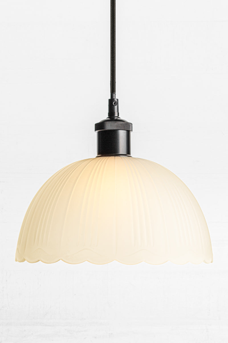 black cord with a frost dome glass shade and scalloped edging