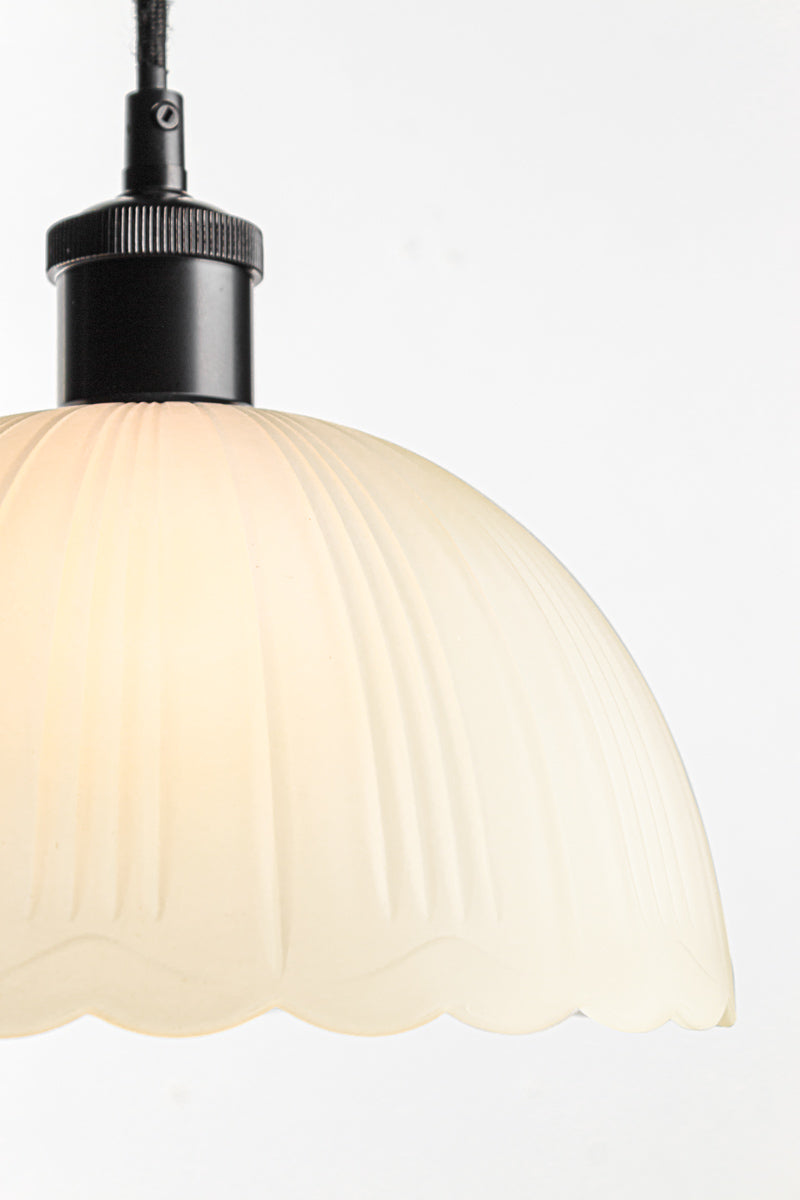 diffused lighting through its frost glass shade and scalloped edging