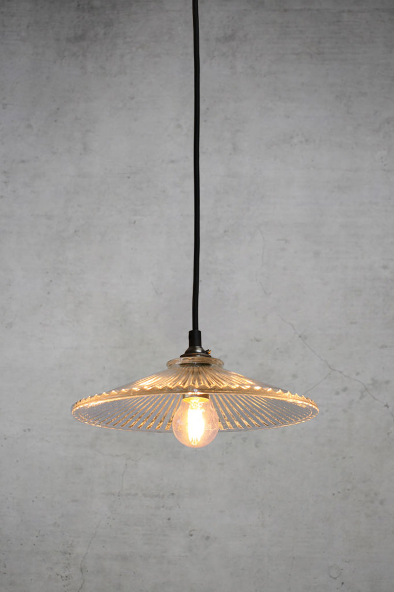 The plymount glass pendant with black braided cloth cord. 