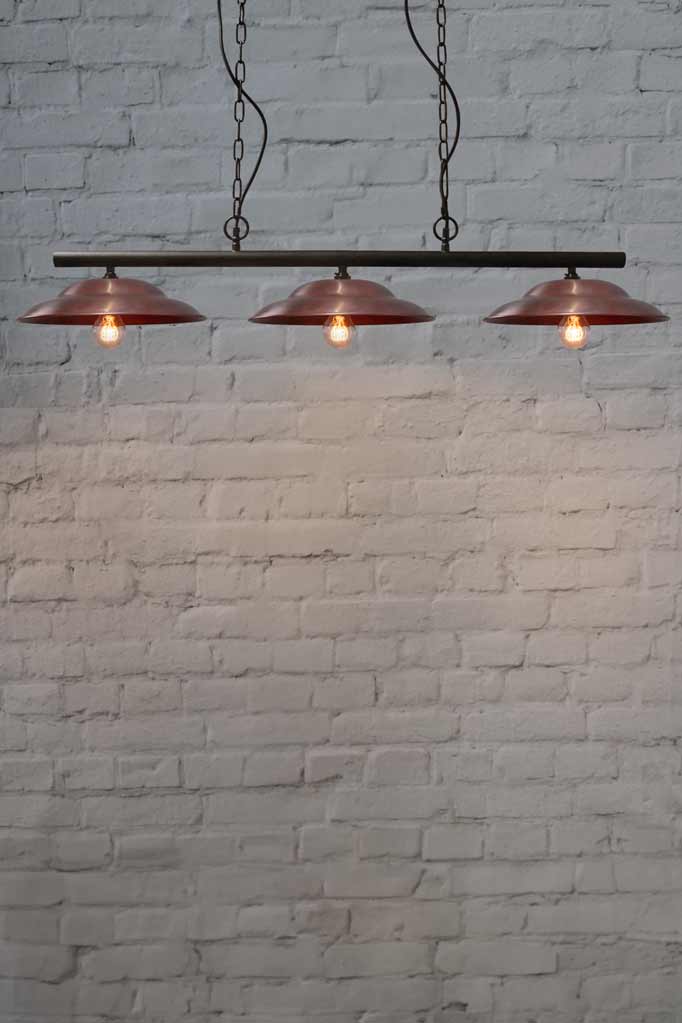 Barn Swing Pendant Light with three copper shades.