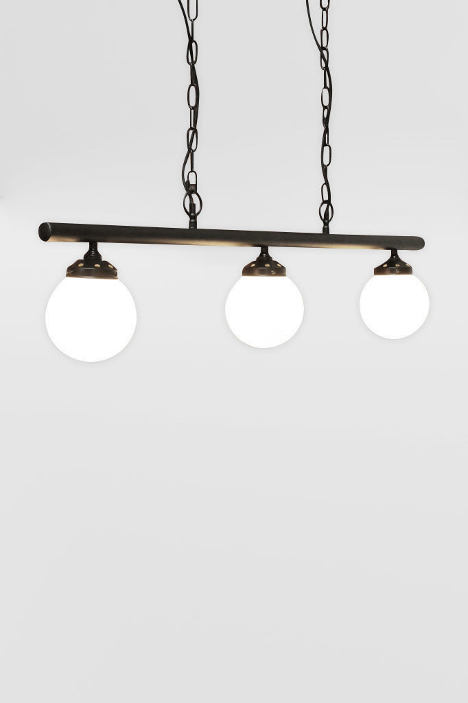 Angeled view of the Small opall shades on the three light linear bar light with black chains. 