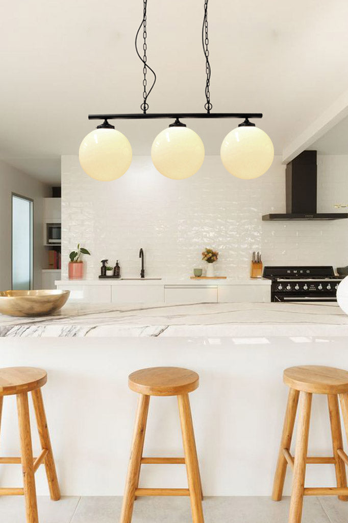 Glass Ball Swing Pendant Light over kitchen island