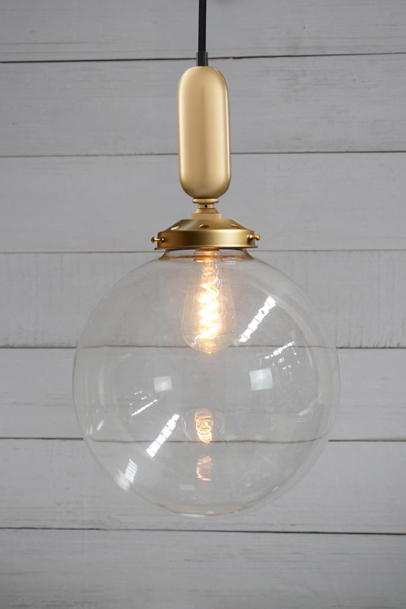 Large clear glass all light with gold gallery and tube on a black cord.