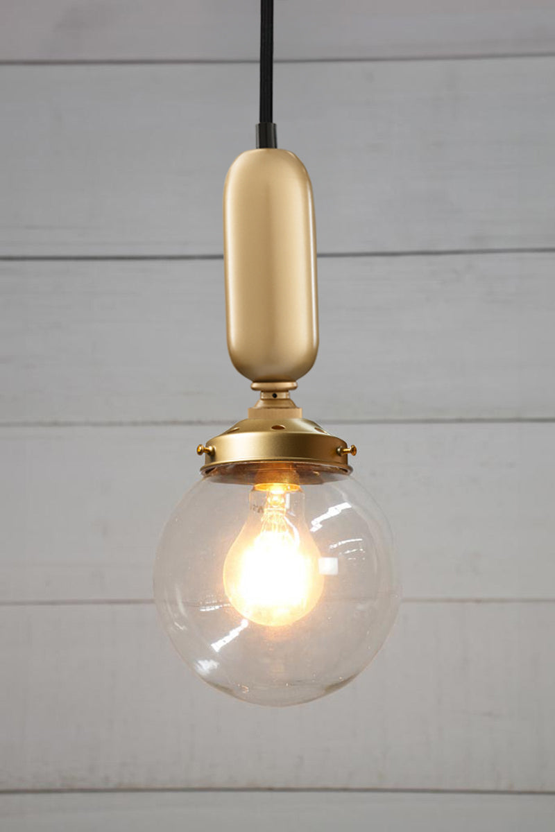 Small clear glass all light with gold gallery and tube on a black cord.