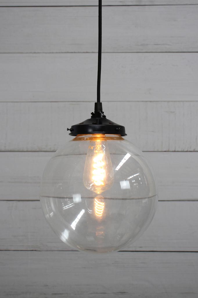 Black round cord pendant light with medium clear shade