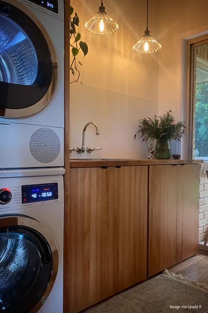 Two clear glass paris pleasted pendant lights hanging in a modern Australiana laundry. 