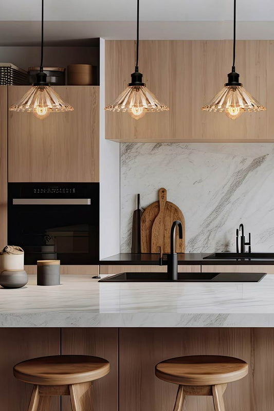 3 Glass pendant lights over kitchen island