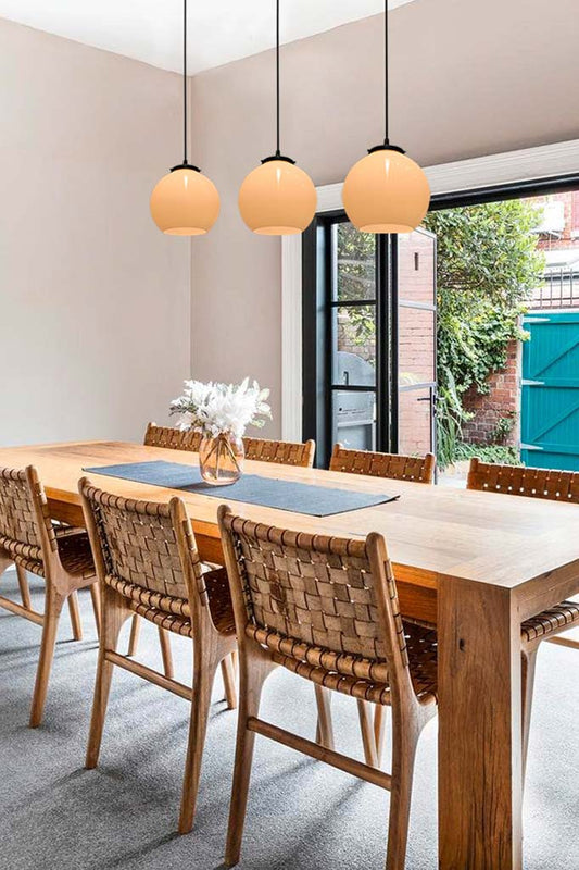 3 glass shades over dining table