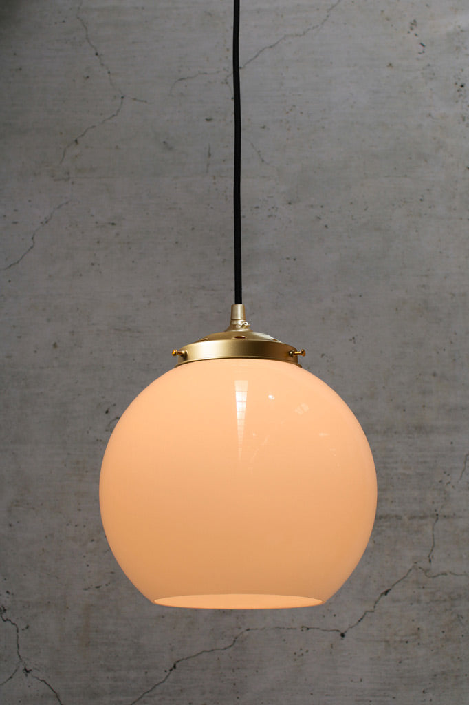 Medilum opal open glass ball shade on a gold/brass gallery and pendeant cord. 