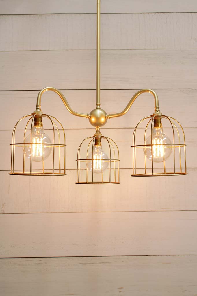 Industrial Gooseneck Cage Chandelier with gold/brass gooseneck three arm fixture and matching cage shades.