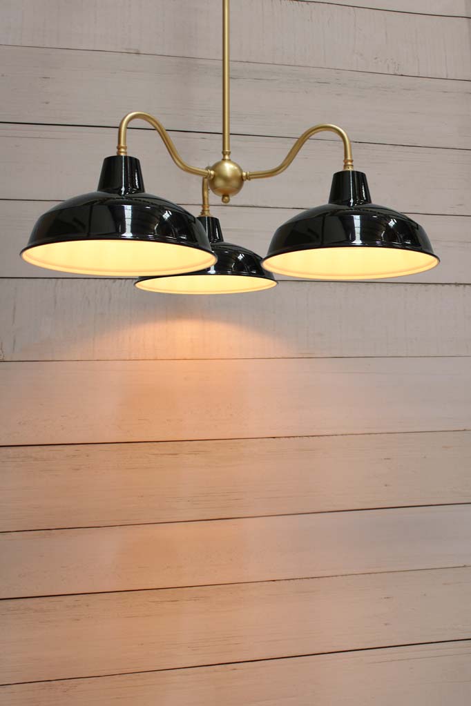 Gold brass gooseneck three arm fixture with black Warehouse shades. 