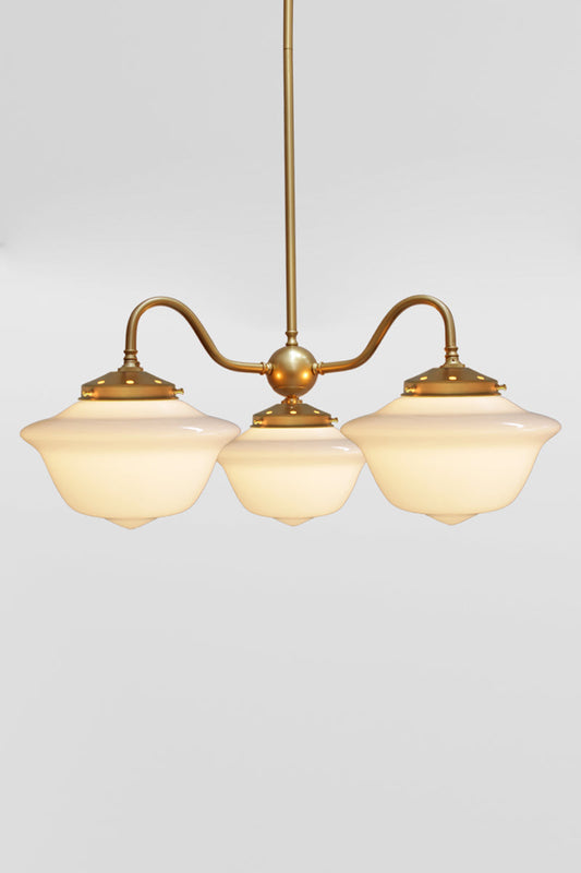 Gold/brass steel, gooseneck 3 arm chandelier with medium opal Chelsea schoolhouse shades. 