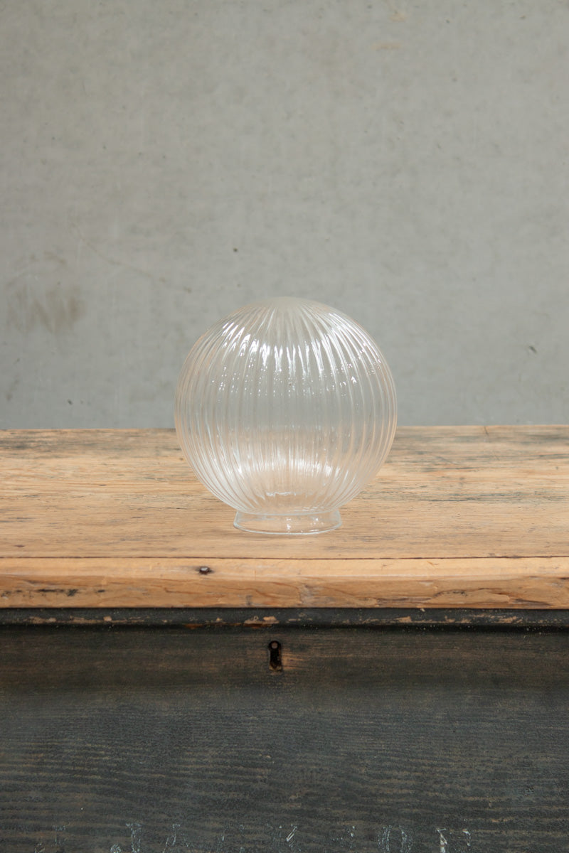 Clear reeded glass shade.