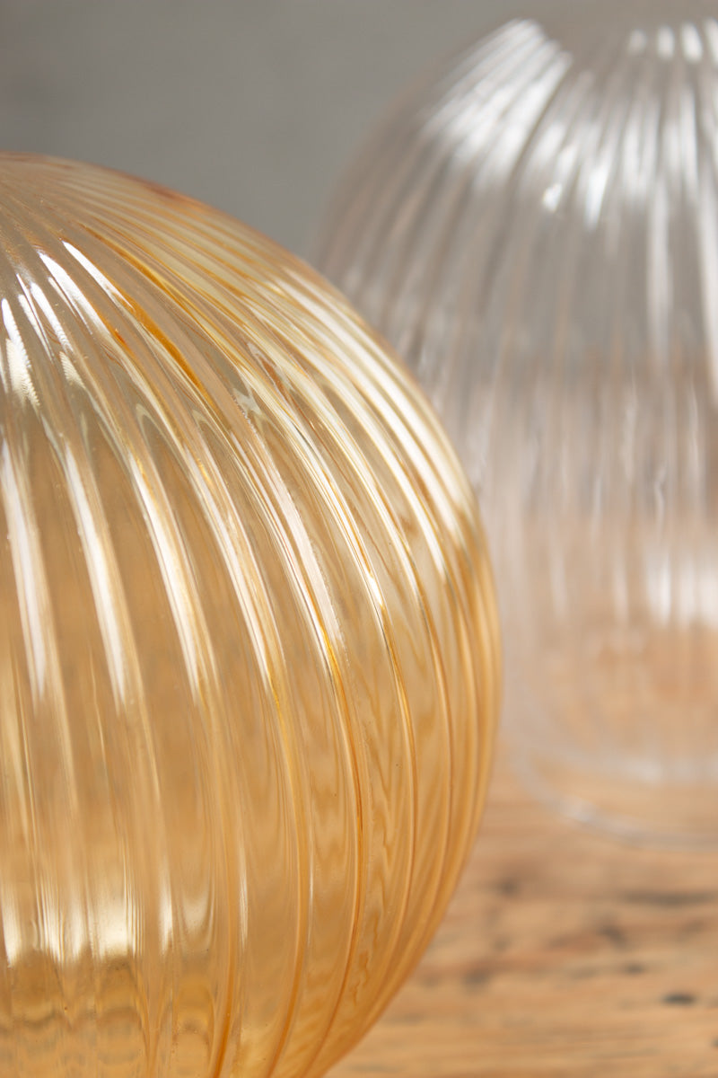 Close up of the reeded glass ball shades in amber and clear.