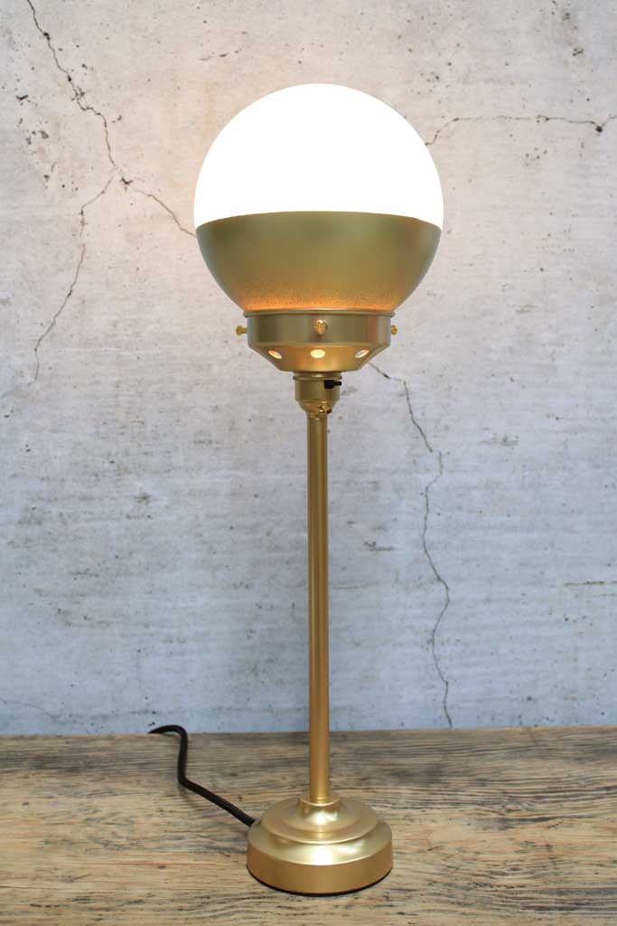 Crown Sphere Table Lamp with a gold lamp hold, gold gallery with a gold and opal shade