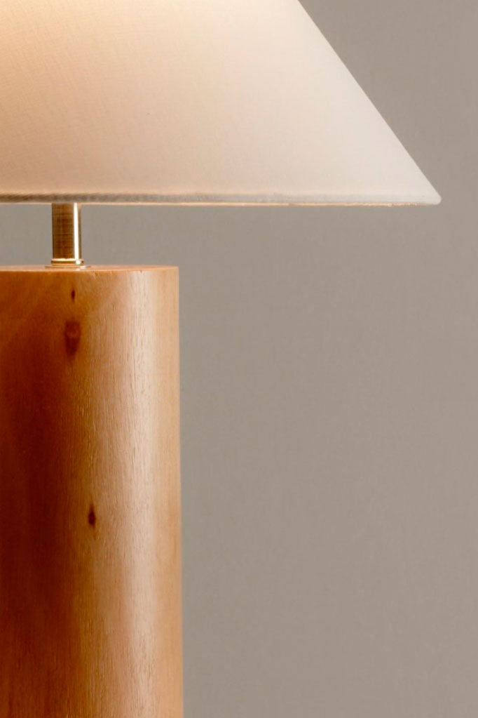 Close-up of the Table Lamp highlighting its natural wood base and white linen shade.