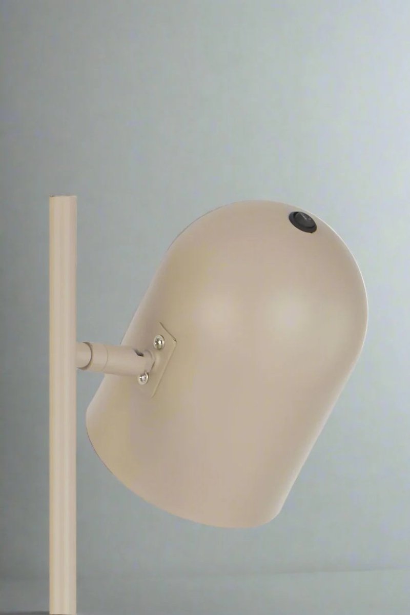 Close up of a shade of a Khaki table lamp with adjustable head