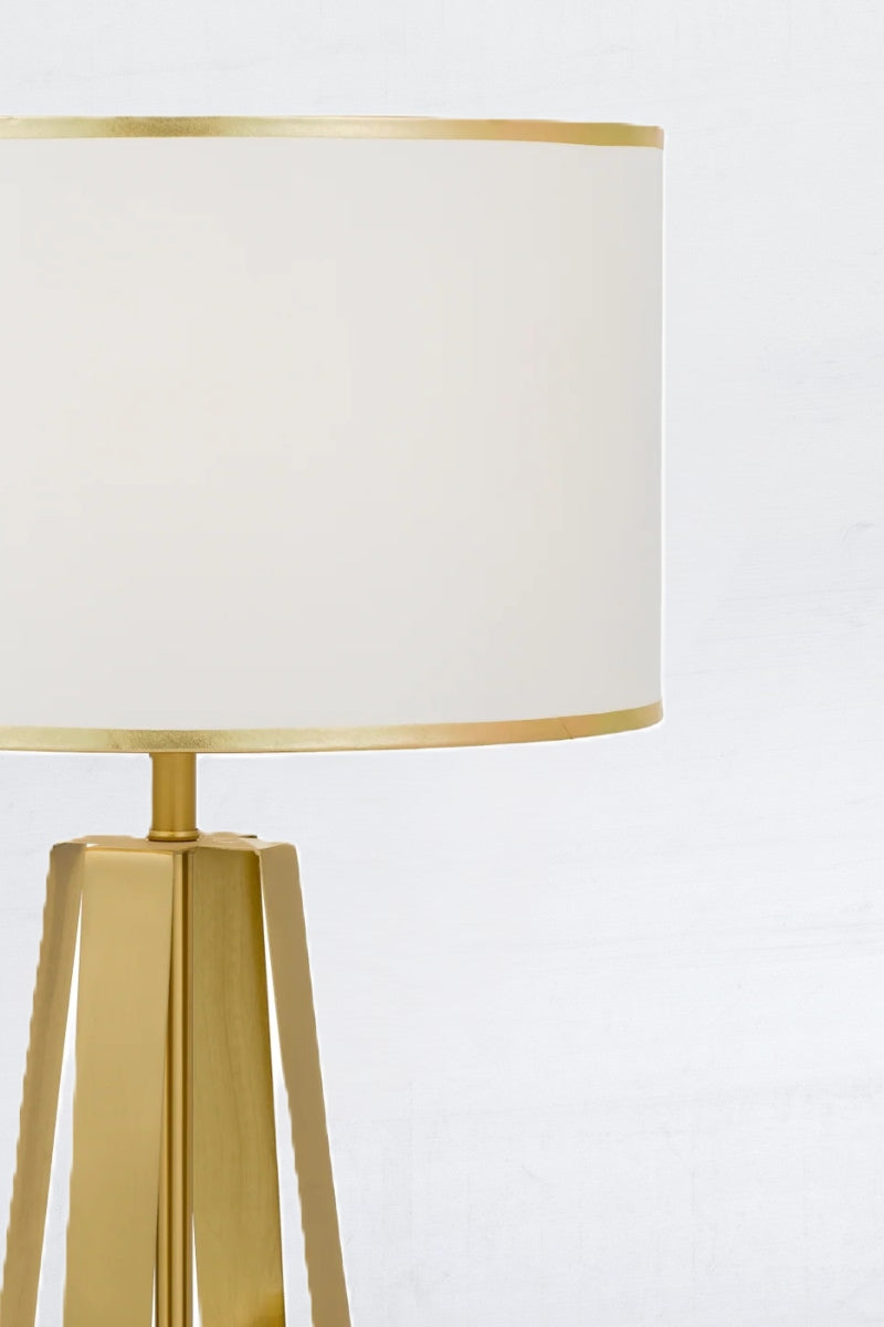 Close up of gold an white table lamp