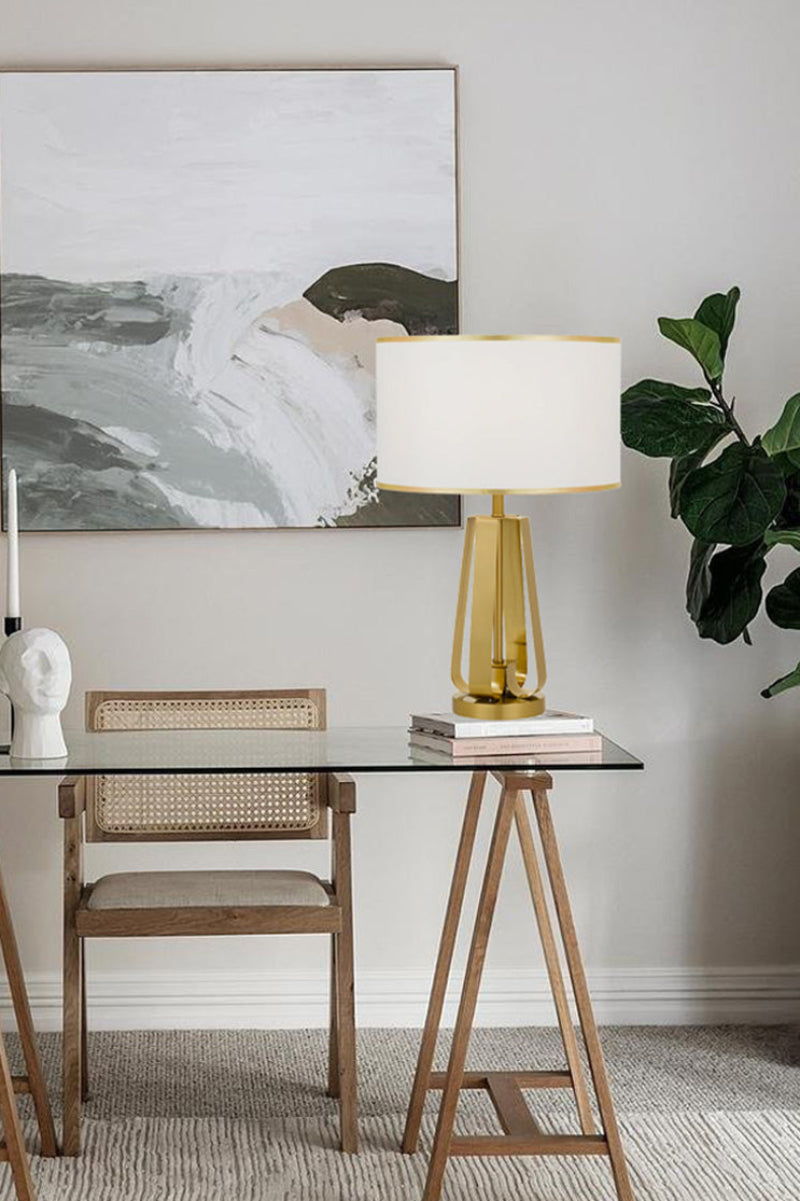 Antique gold lamp on a desk in a study