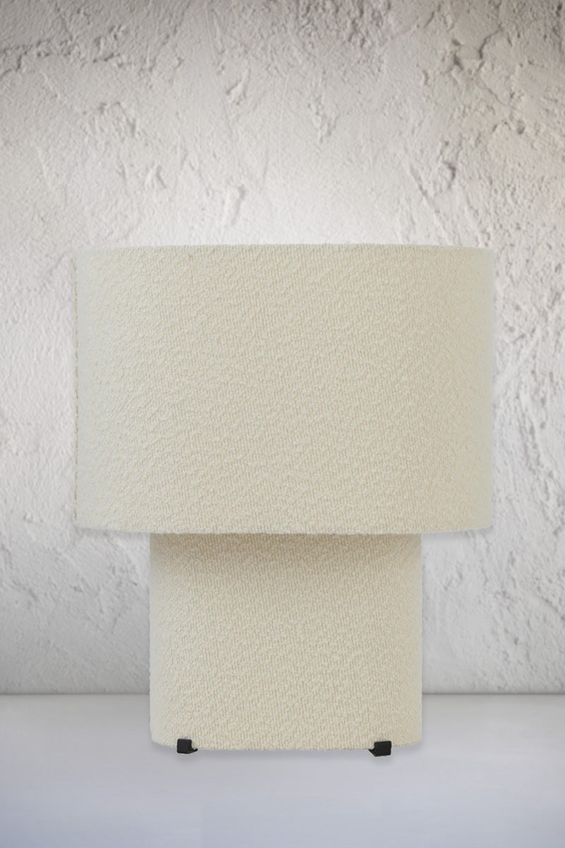 Ivory broulee fabric table lamp. 