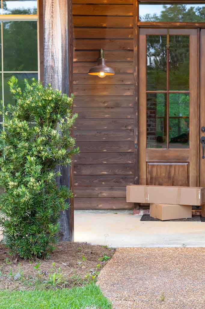 copper outdoor wall light on the front door porch