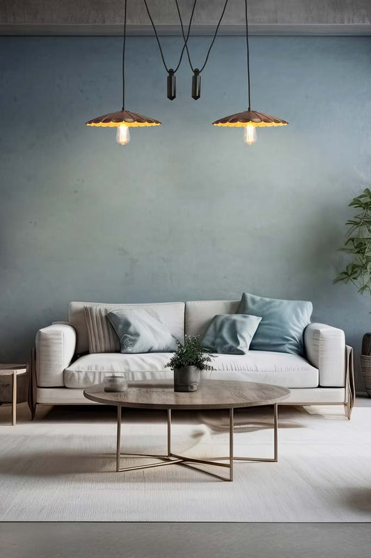 2 Vintage Umbrella Pulley Pendant Lights in the middle of a living room.