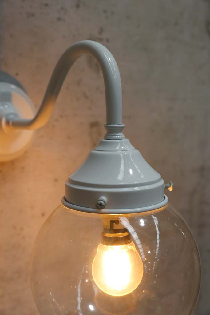 small clear shade exterior light with white gooseneck arm