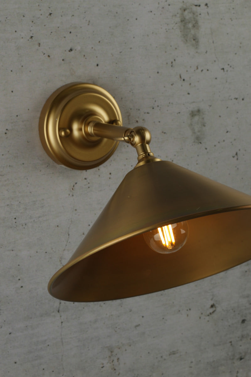 Small aged brass cone wall light with brass arm