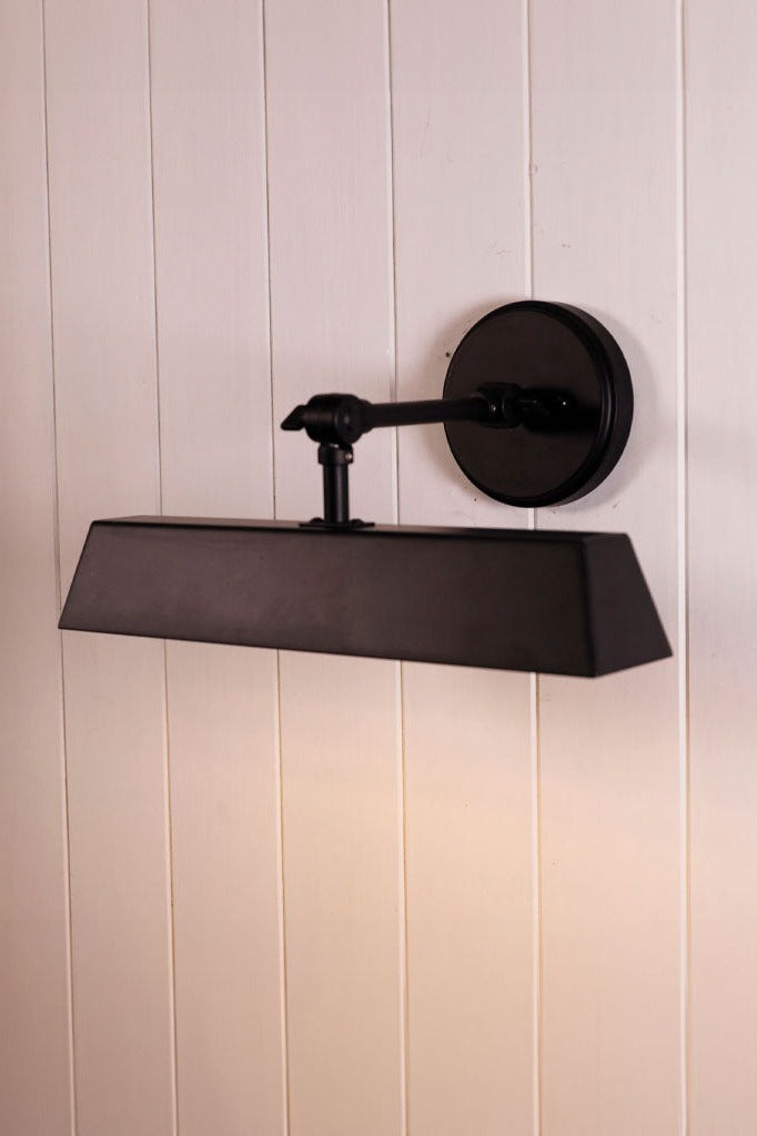 Wall Light with an adjustable shade.