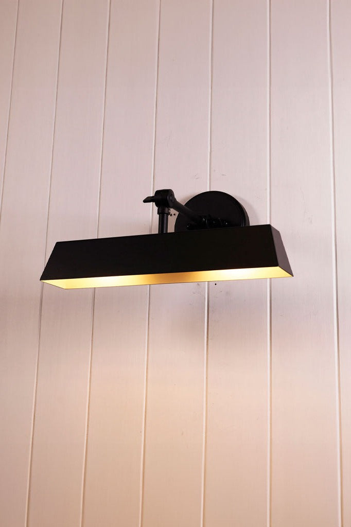 Wall Light with an adjustable arm for its shade.