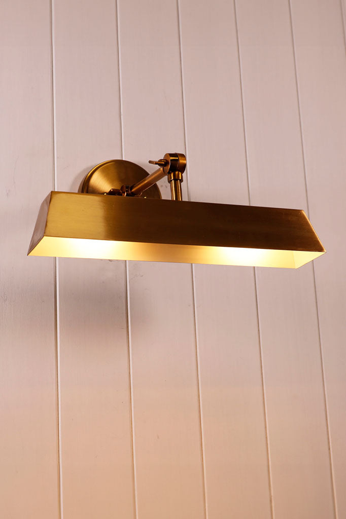 wall light in gold brass finish