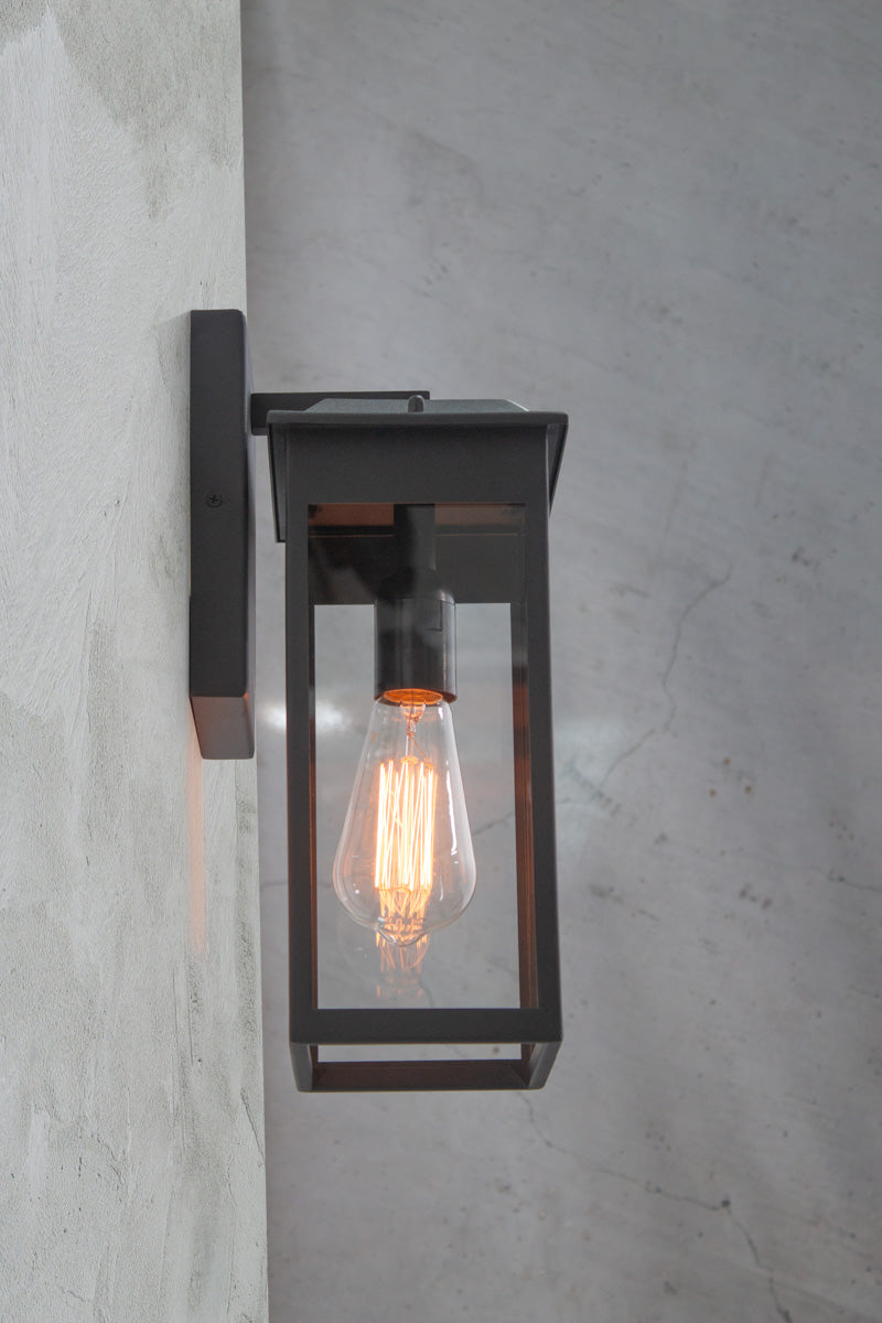 Side view of the Barrowgate Exterior Wall Light illuminated.