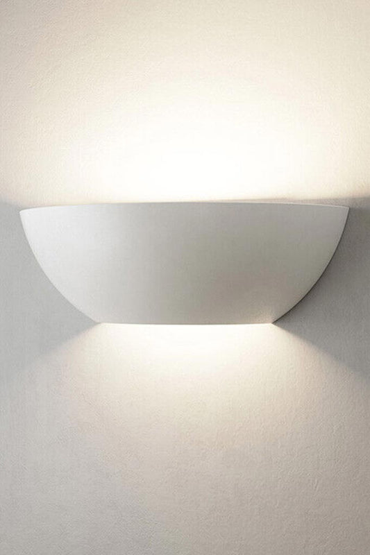 Front view of the dish shaped plaster wall light.