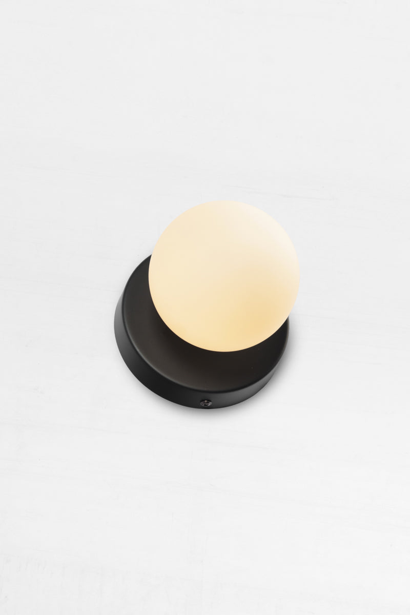 Brooklyn Steel Orb Wall Sconce has a small opal shade