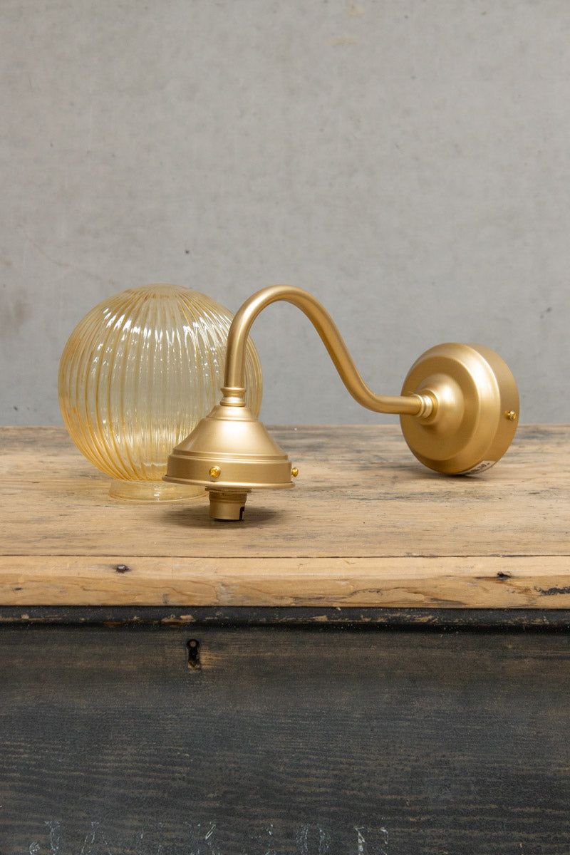 gold brass gooseneck arm and amber reeded shade